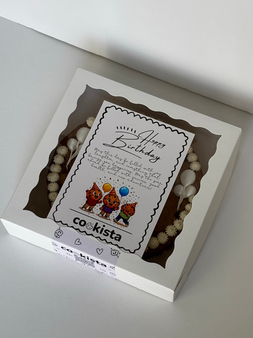 A white elegant gift box with a clear window displaying a cookie cake inside, featuring a printed cute birthday card.